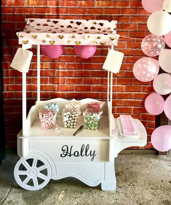 pink themed kids lolly cart for child's birthday party