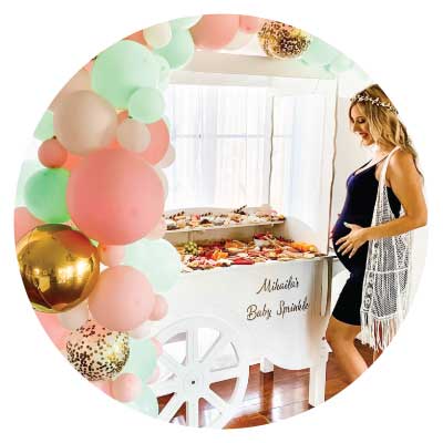 Lady celebrating baby shower with Party Cart